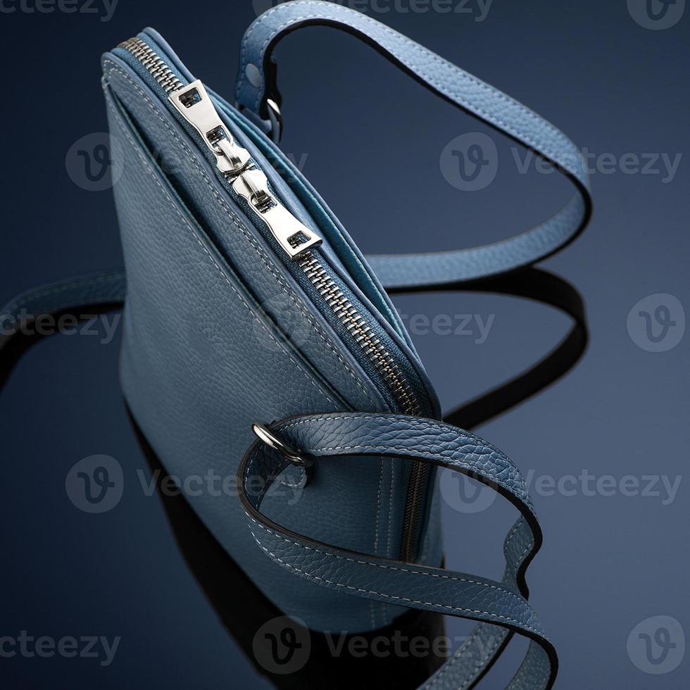 A closeup shot of a luxury blue leather bag photo