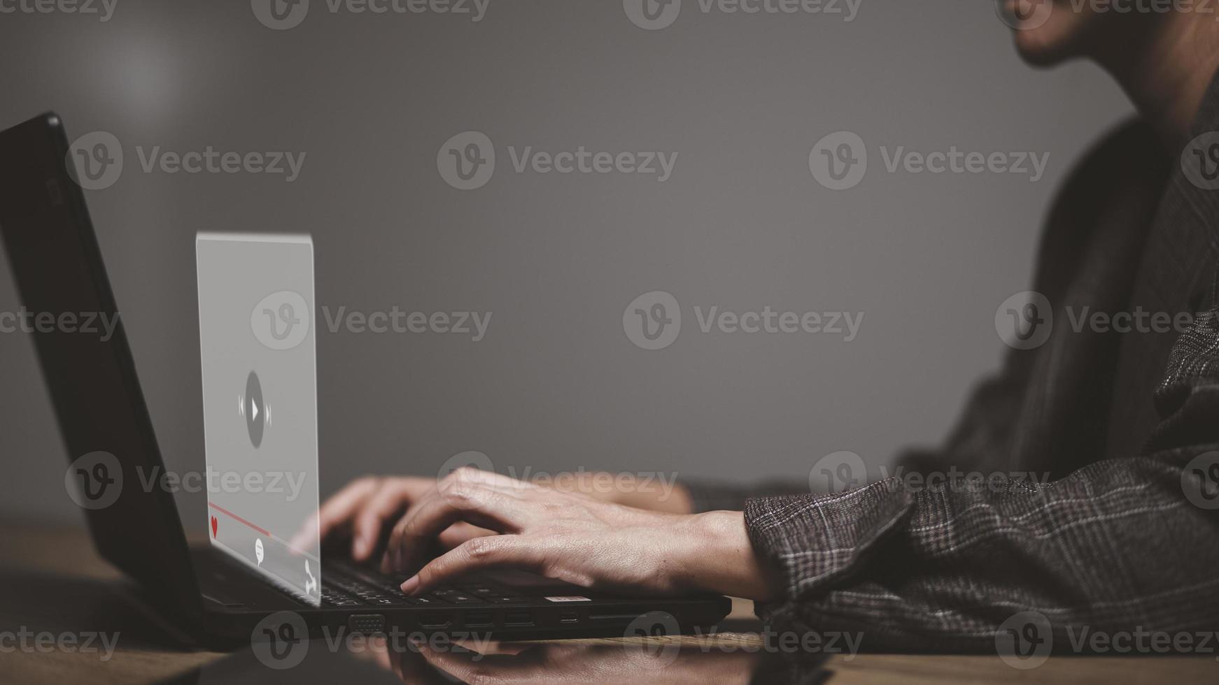 hands of women using laptop for streaming online, watching video on internet, live concert, show or tutorial photo