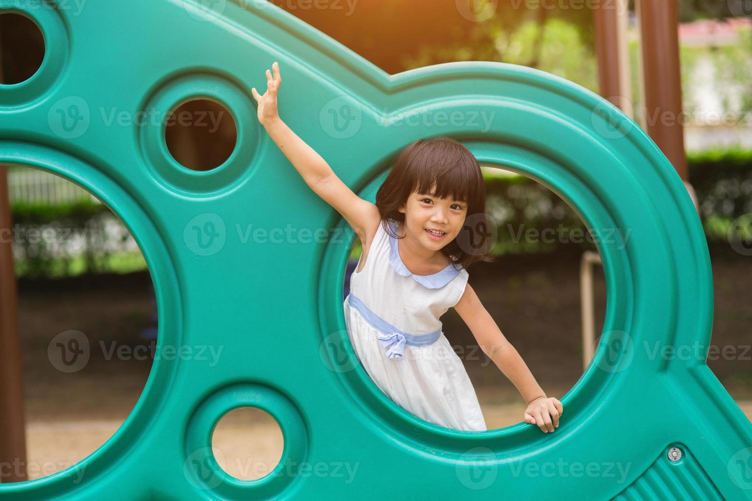 Active little girl on playground photo