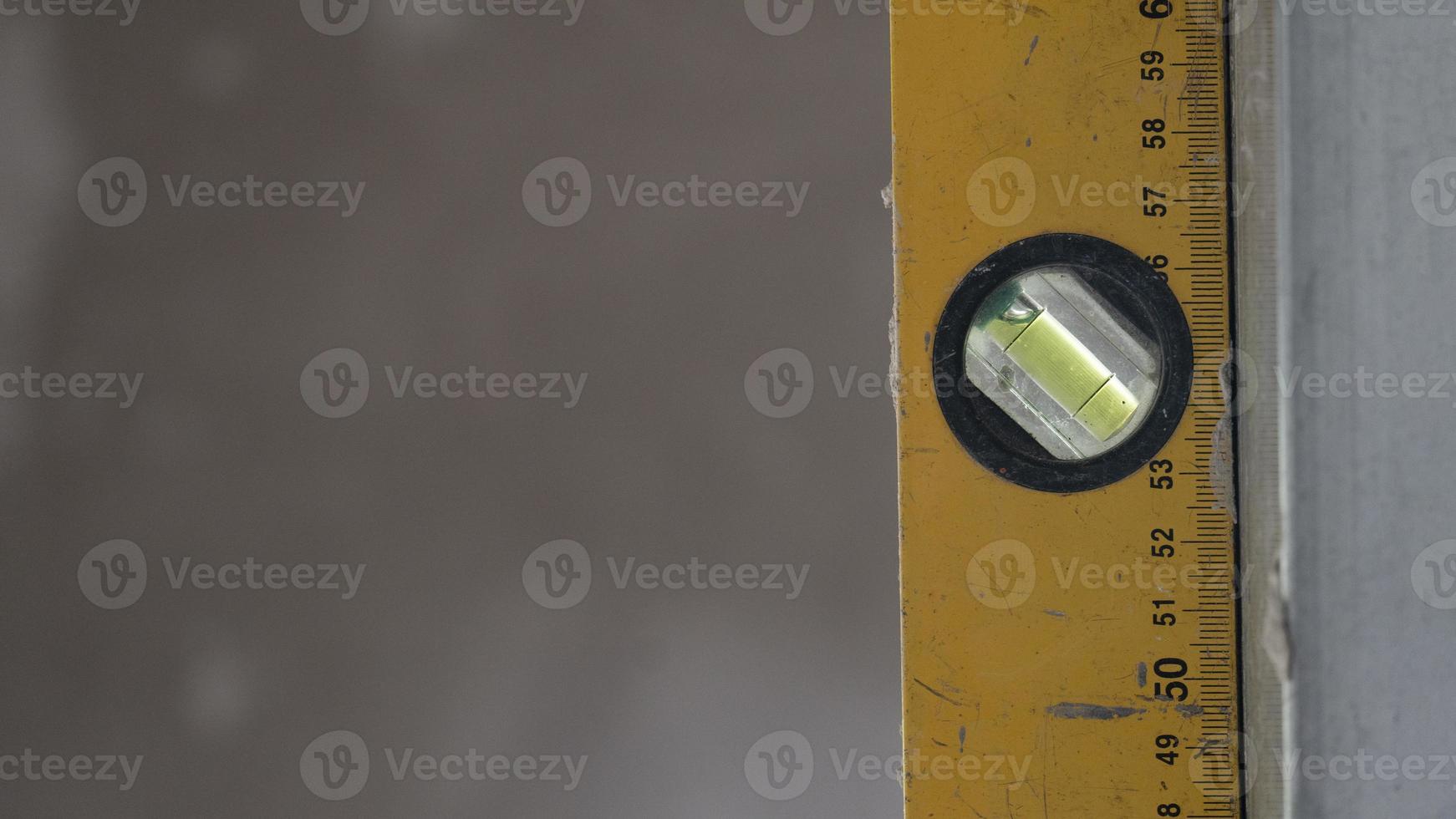 Construction background of ruler to measure the water level that sticks to the steel plate. photo