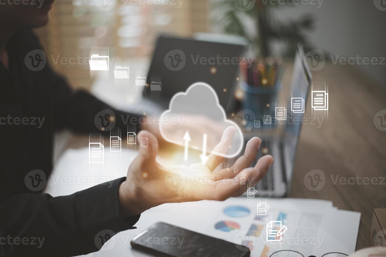 man use Laptop with cloud computing diagram show on hand. Cloud technology. Data storage. Networking and internet service concept. photo