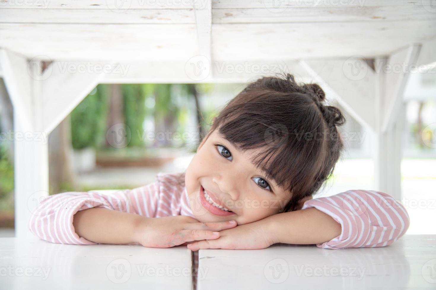 Happy little girl having fun at home photo