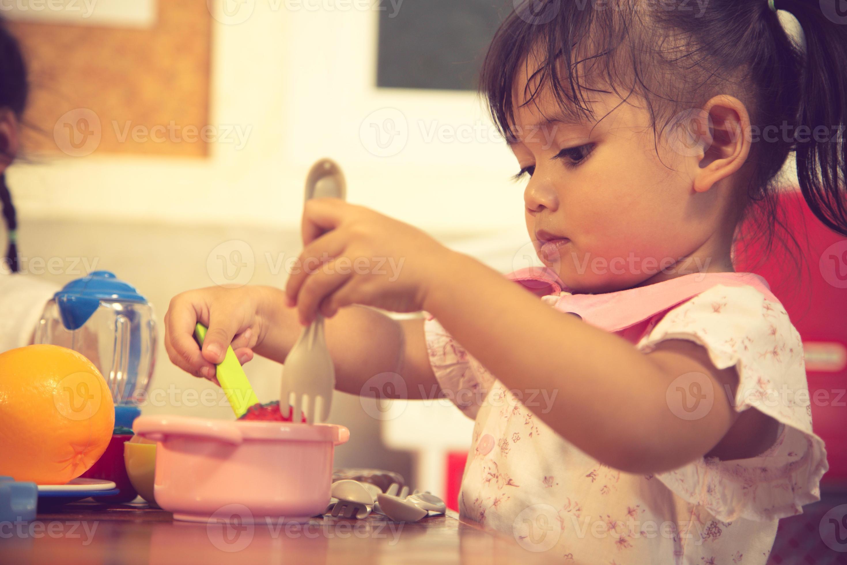 baby girl pretend play food toy 13063986 Stock Photo at Vecteezy
