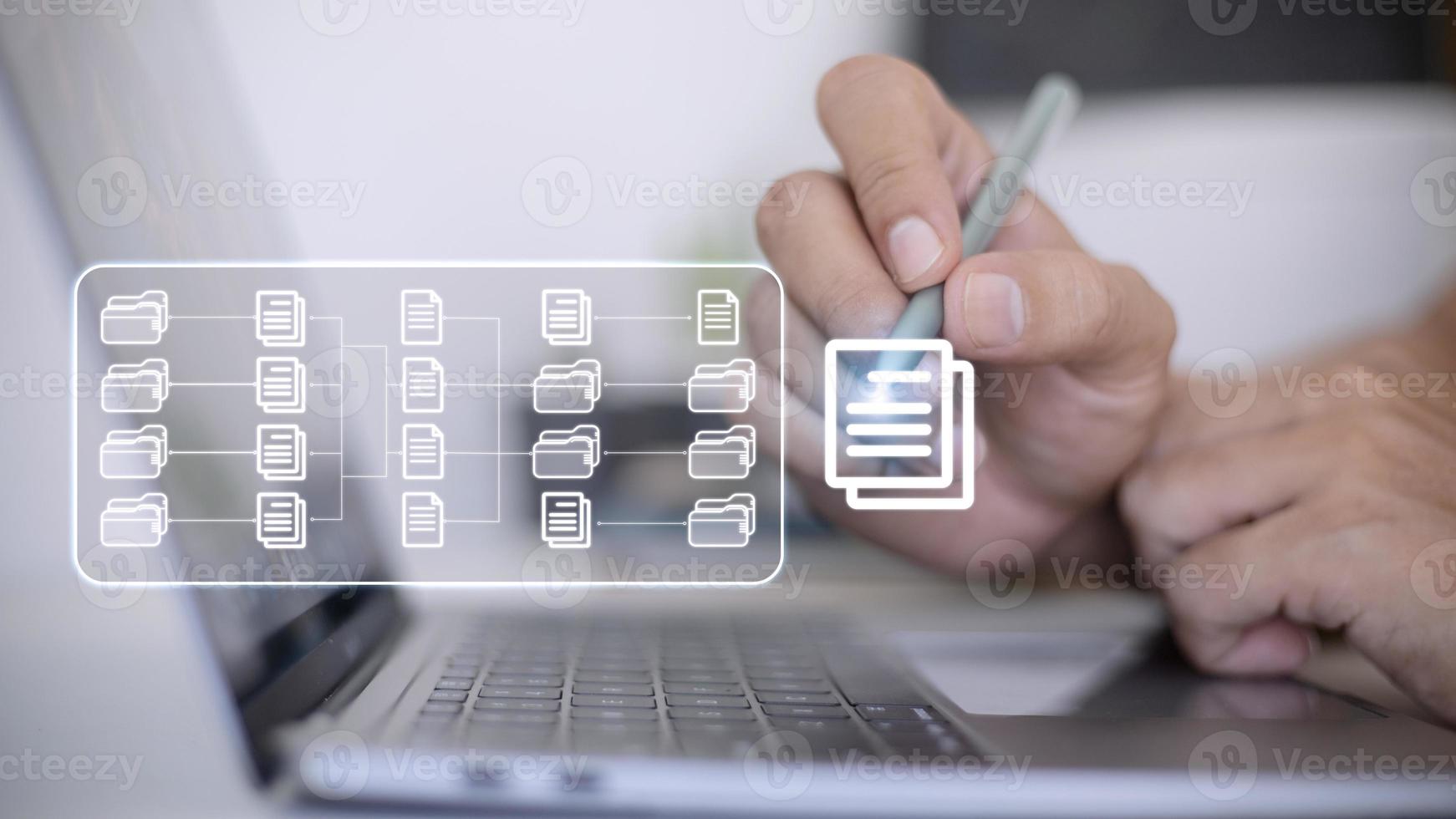 Document Management System DMS being setup by IT consultant working on laptop computer in office. Software for archiving, searching and managing corporate files and information photo