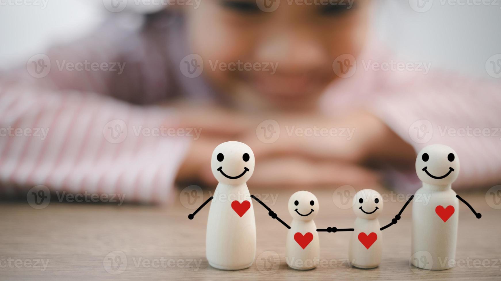 wooden figures of family members, Family relationship symbol, family home lockdown concept , Insurance and property investment, homeless support, world mental health day photo
