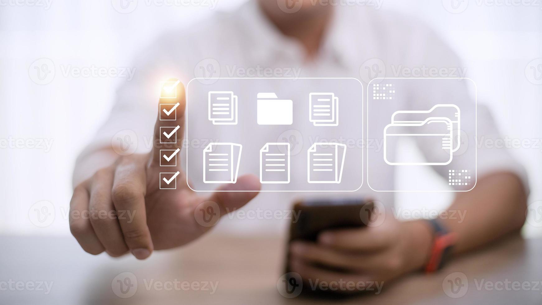 Document Management System DMS being setup by IT consultant working on laptop computer in office. Software for archiving, searching and managing corporate files and information photo