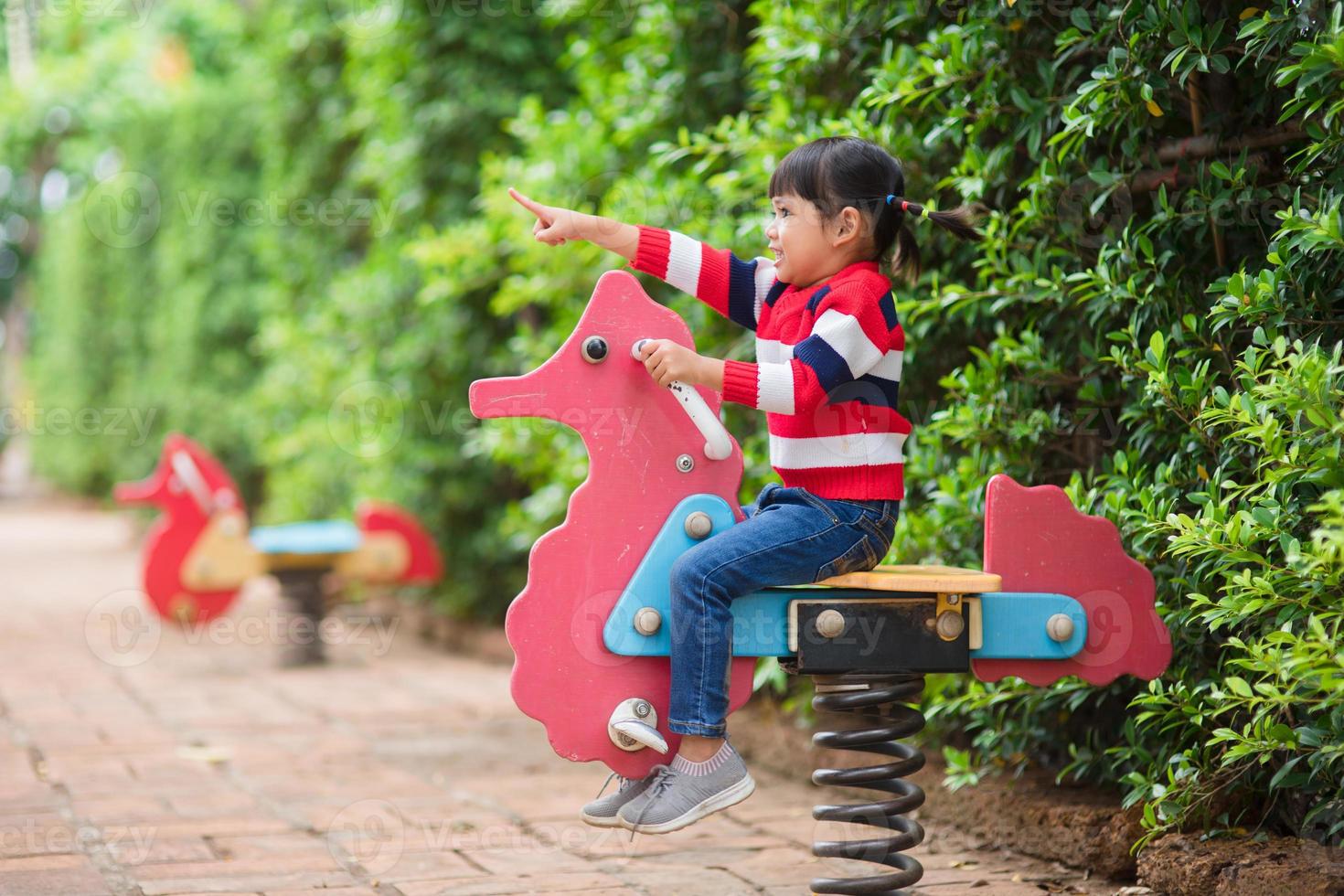 Active little girl on playground photo