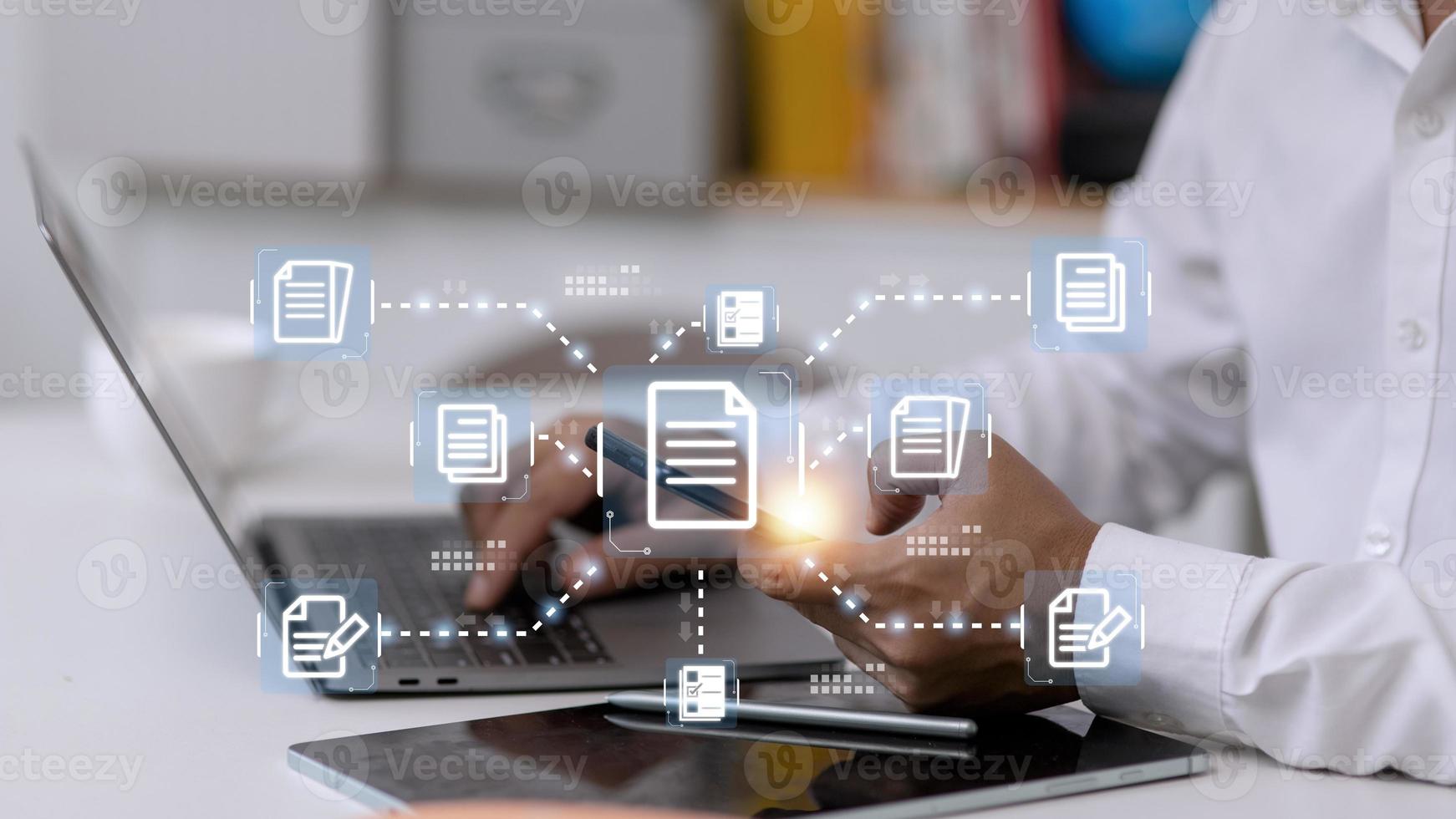 Businessman working with electronics document icons, E-document management, online documentation database, paperless office concept photo