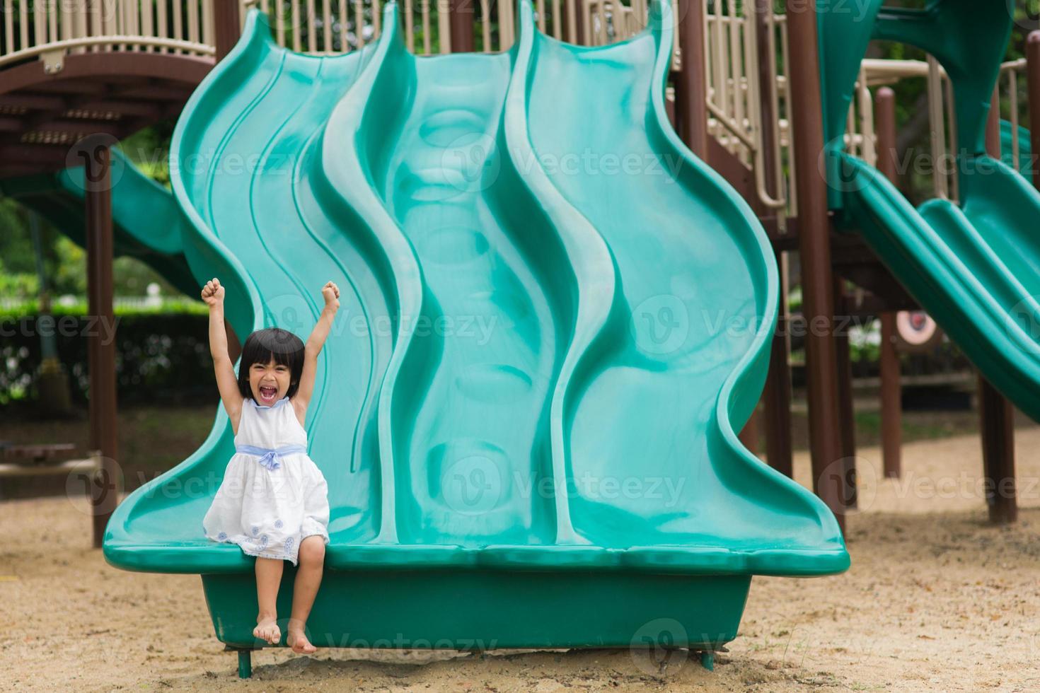 Active little girl on playground photo