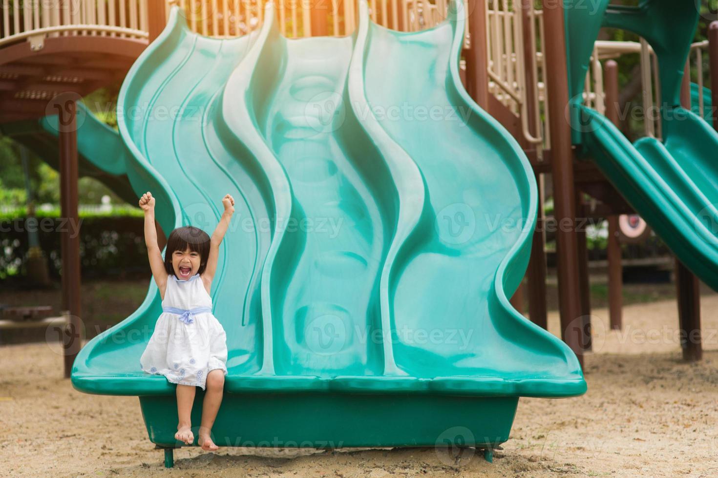 Active little girl on playground photo