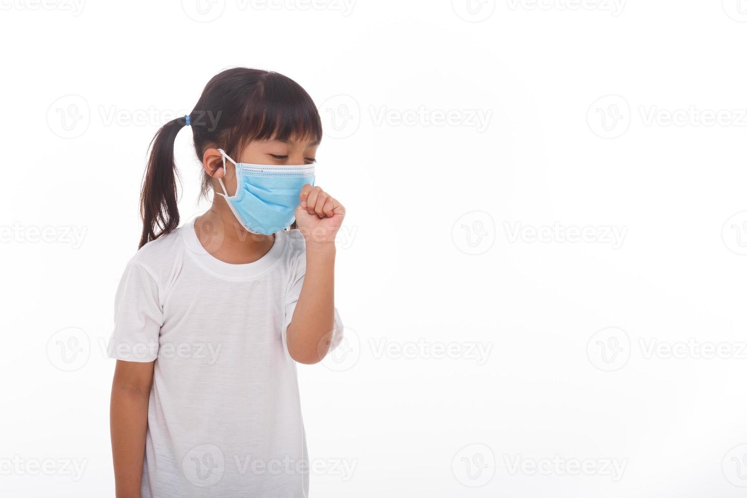 asia women wearing mask to prevent the virus PM2.5, Coronavirus, 2019-nCoV asian little girl feeling unwell and coughing as symptom for cold or pneumonia,bronchitis. healthcare concept. photo