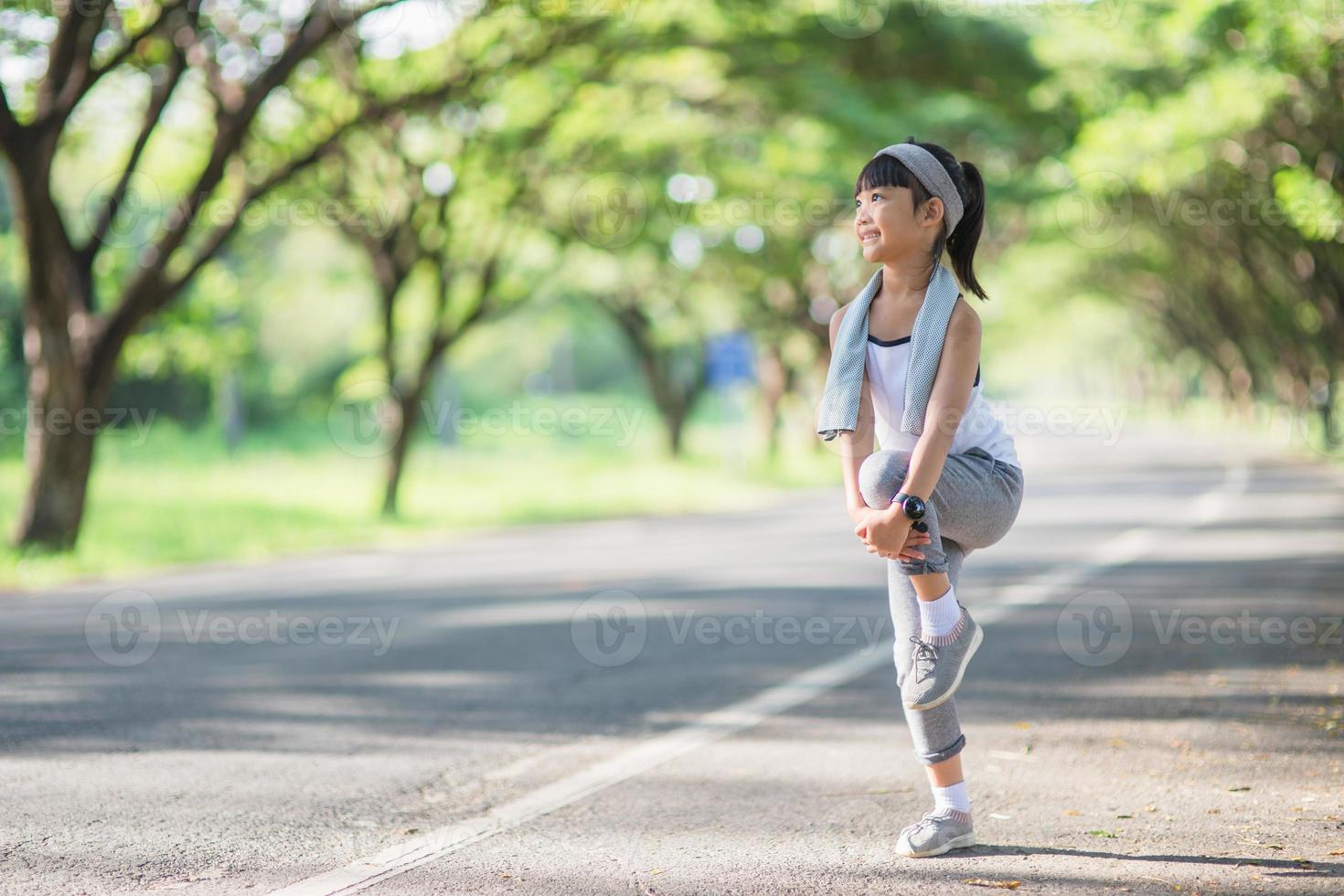 Cute asian girl exercise in gardent background photo