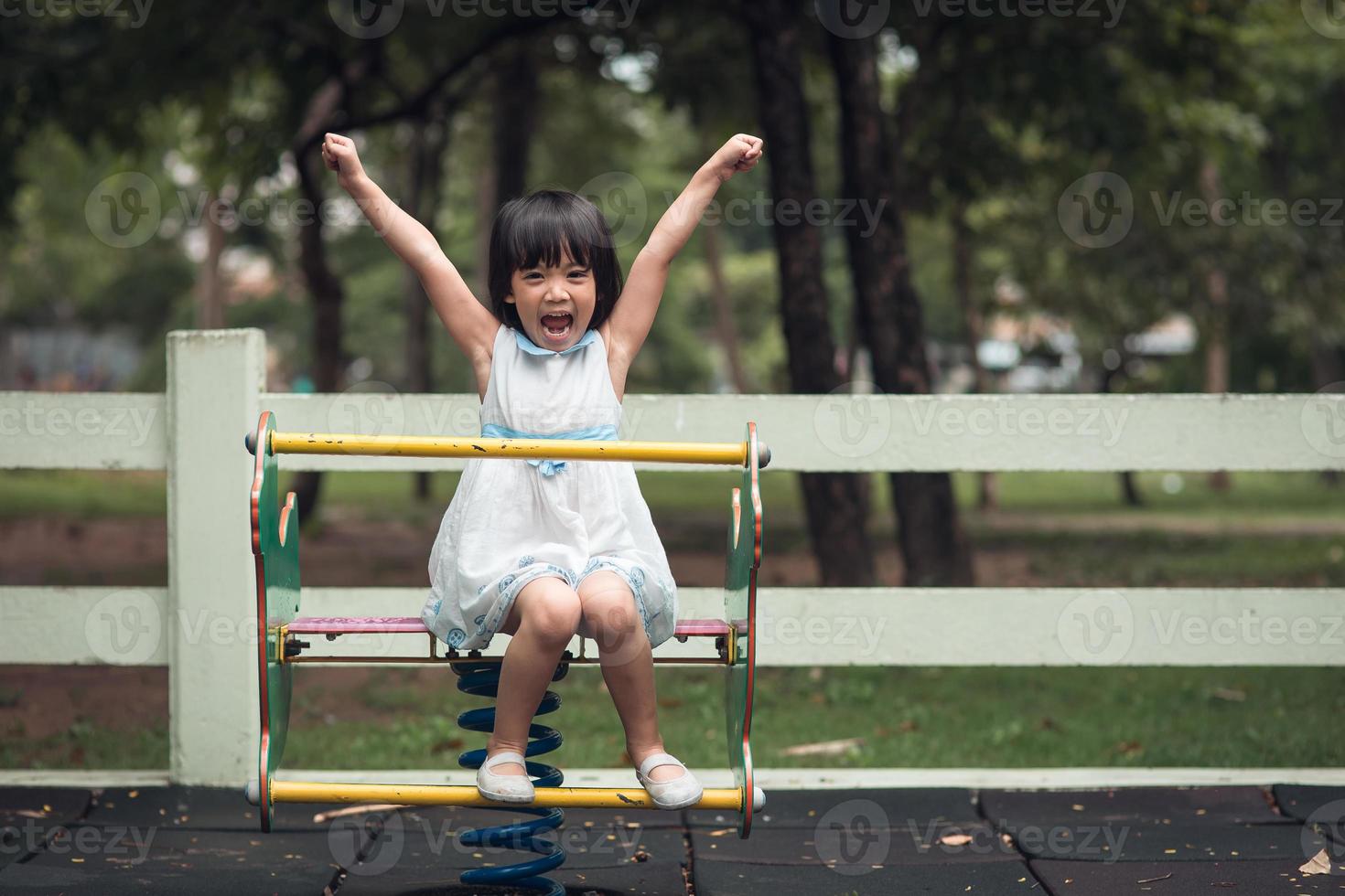 Happy cute kids having fun at playground photo