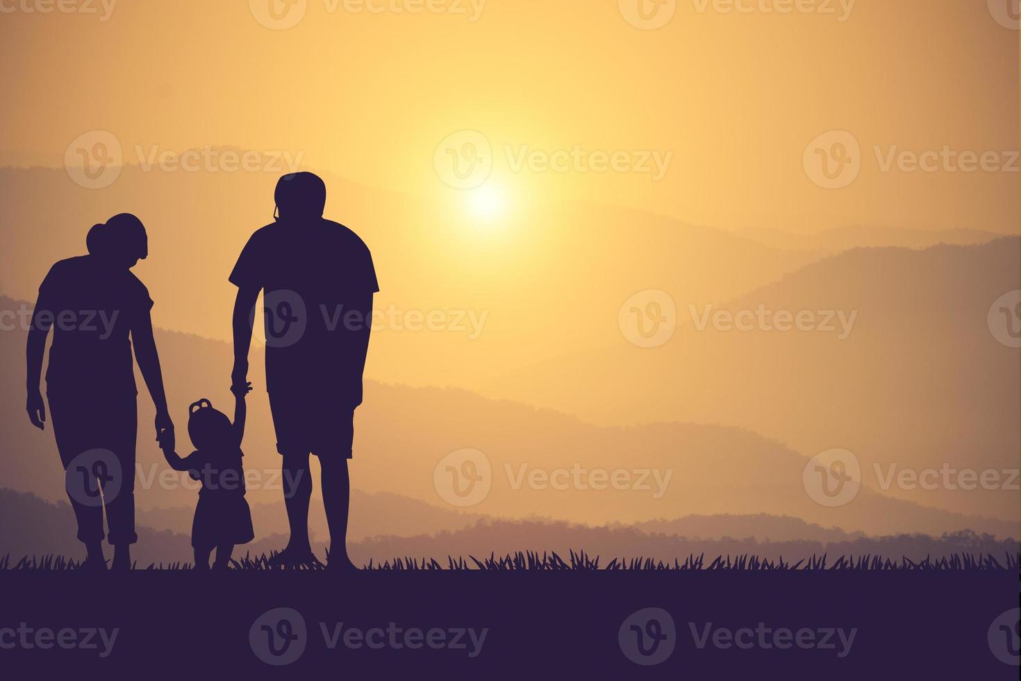 silhouette of a happy family and happy time sunset photo