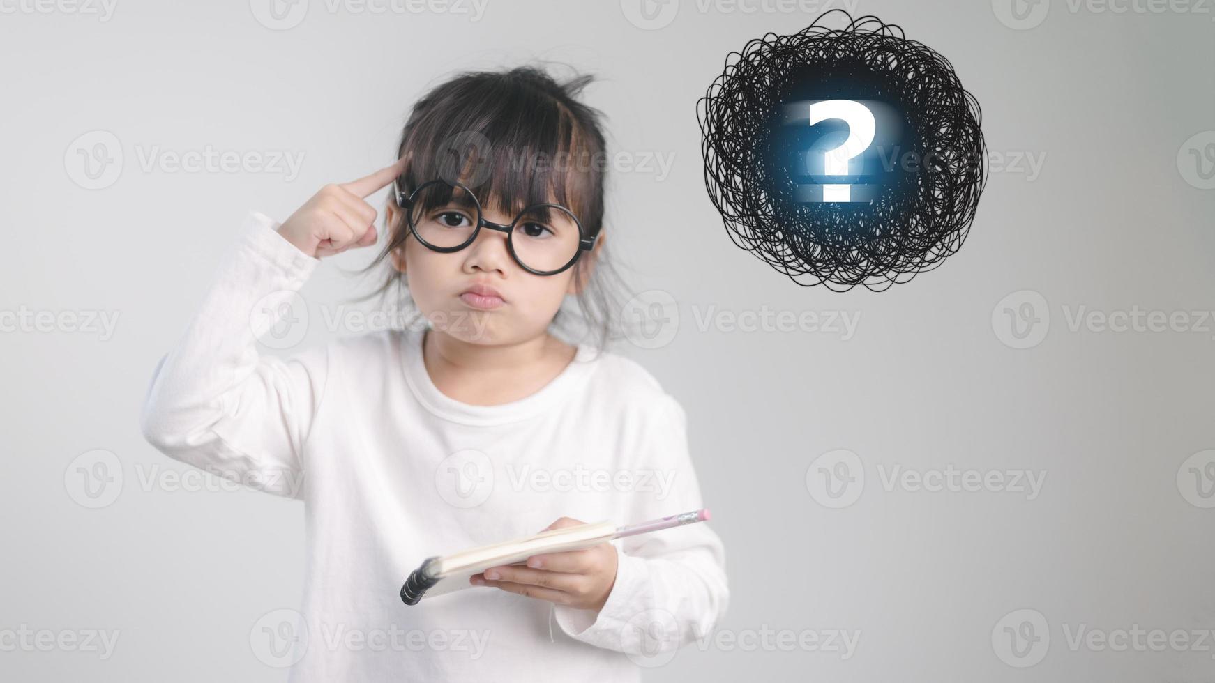 asian little girl thinking with question mark photo