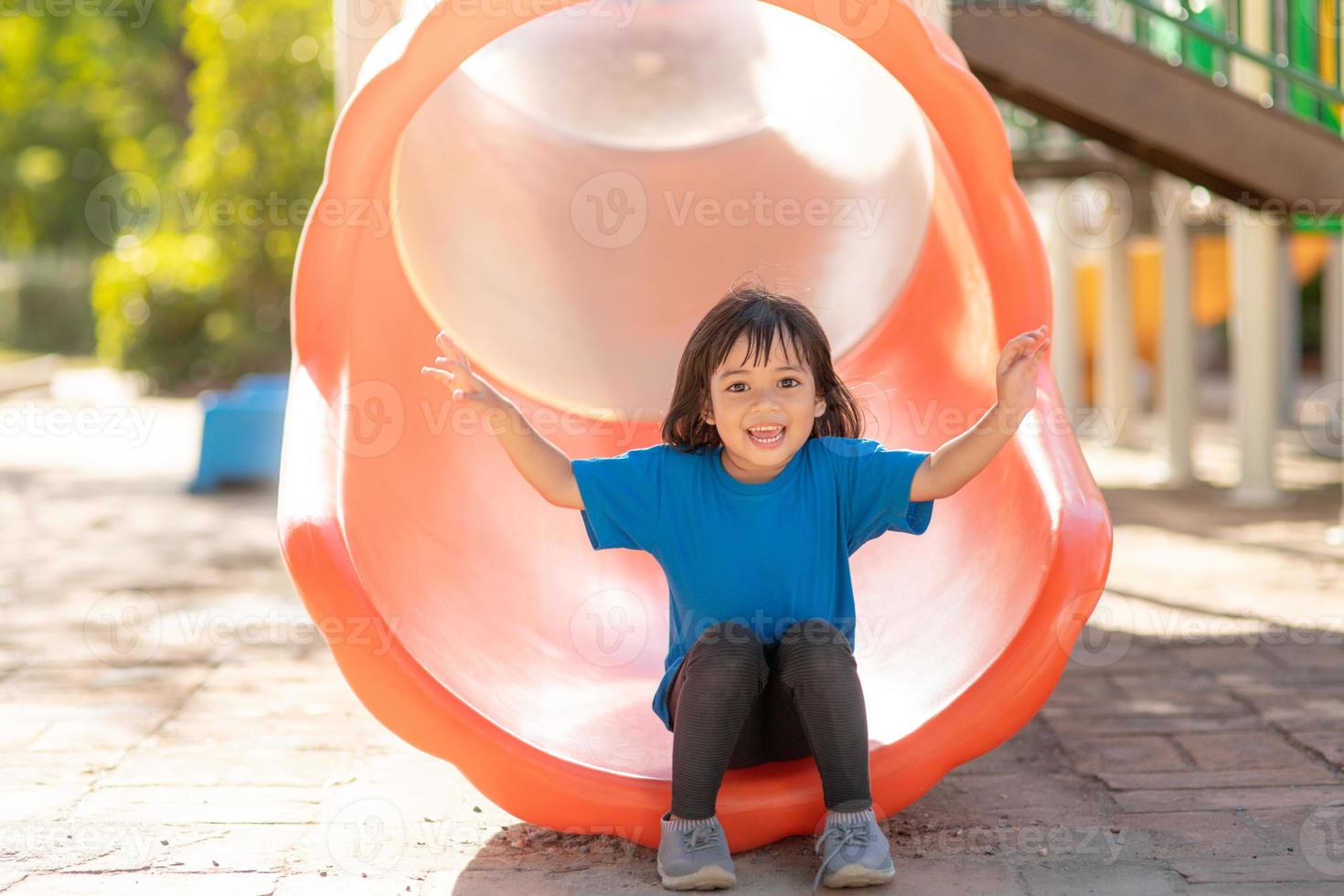 Active little girl on playground photo