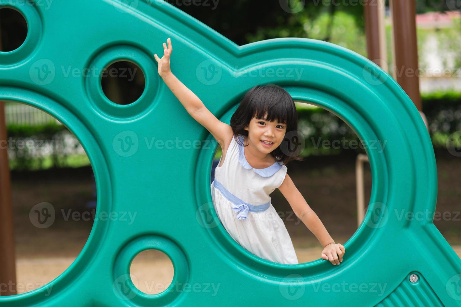 Active little girl on playground photo