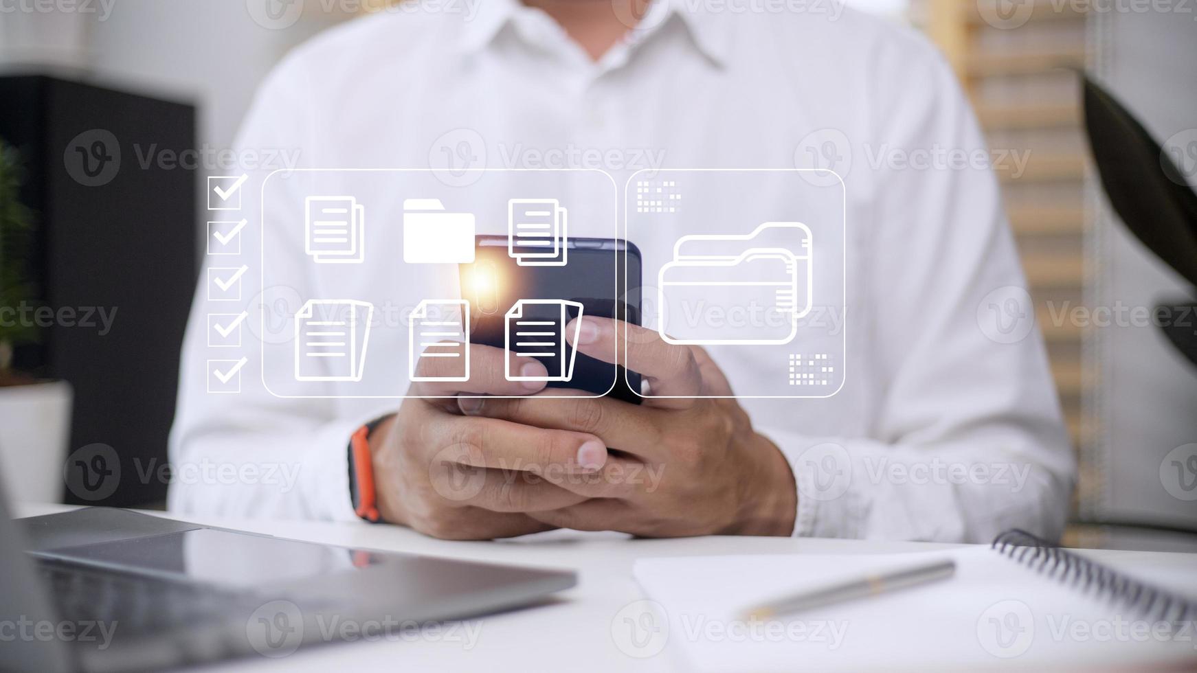 Document Management System DMS being setup by IT consultant working on laptop computer in office. Software for archiving, searching and managing corporate files and information photo