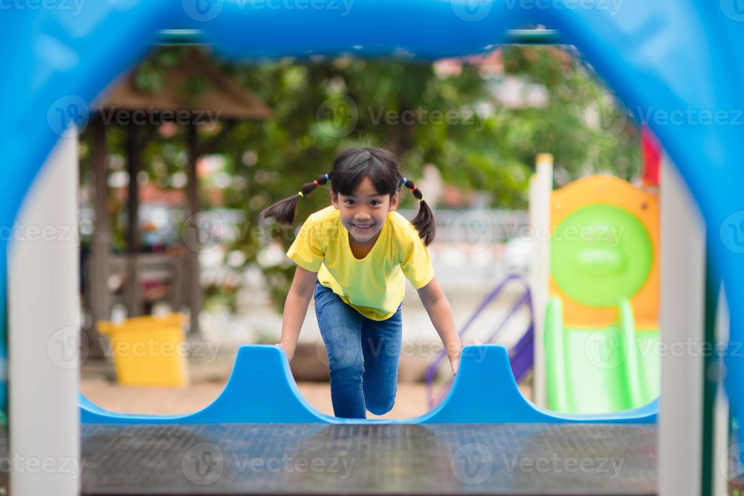 Active little girl on playground photo