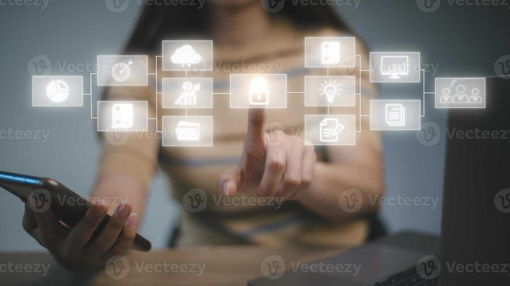 Big data analytics and business intelligence concept with chart and graph icons on a digital screen interface and a businesswoman in background photo