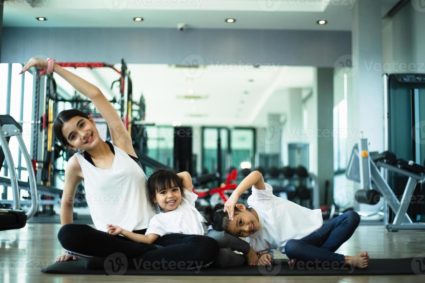 Group of children doing gymnastic exercises photo