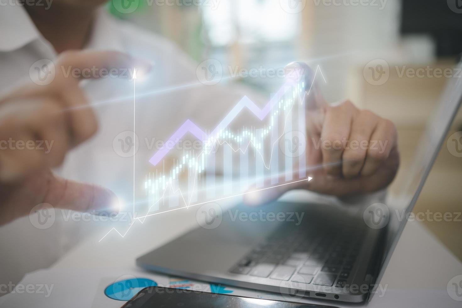 The concept of big data analytics and business intelligence. On a virtual screen, there are financial charts. photo