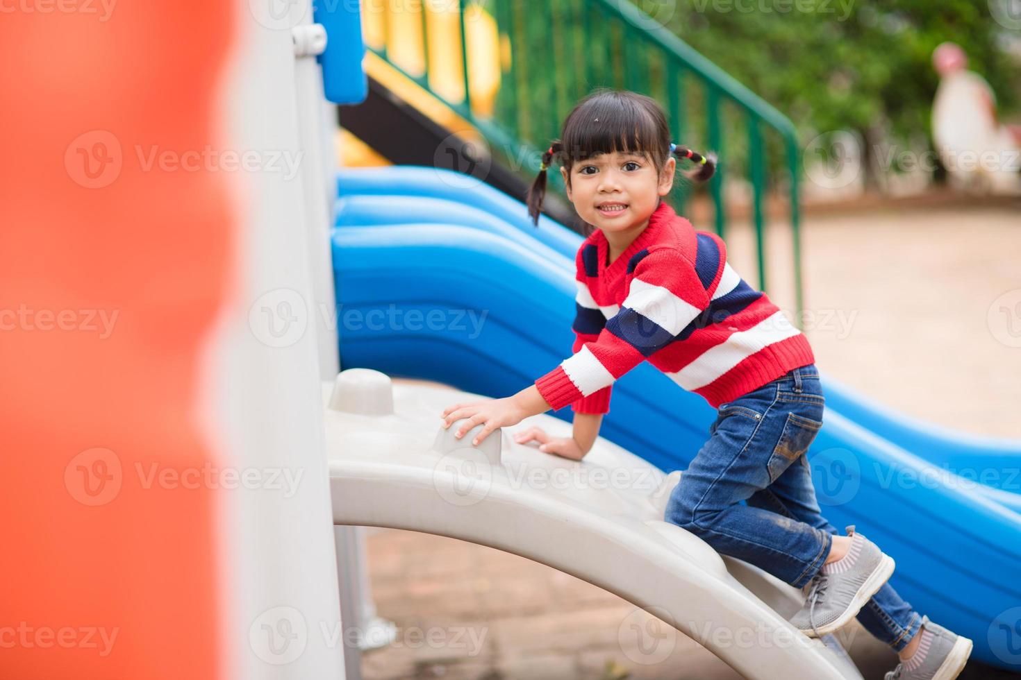 Active little girl on playground photo