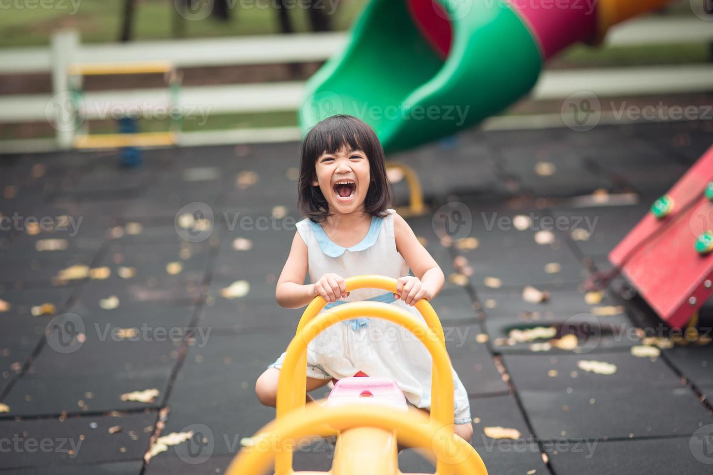 Happy cute kids having fun at playground photo