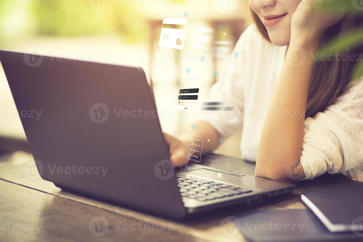 Business, technology, internet and networking concept. businesswoman working on his laptop at home, select the icon on the virtual screen. photo