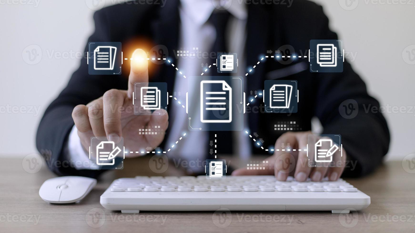 Businessman working with electronics document icons, E-document management, online documentation database, paperless office concept photo