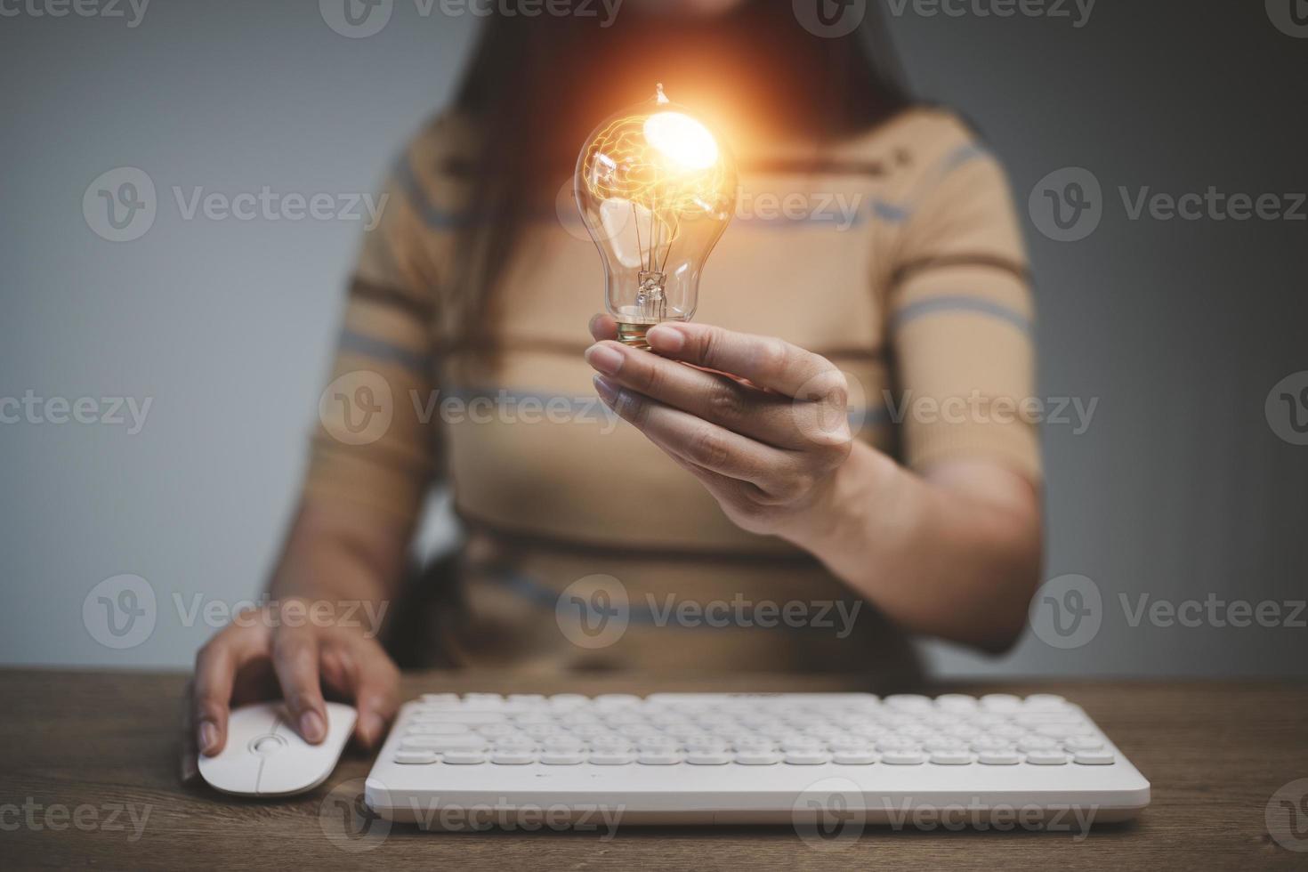 Hand of woman holding illuminated light bulb, idea, innovation and inspiration concept.concept creativity . photo