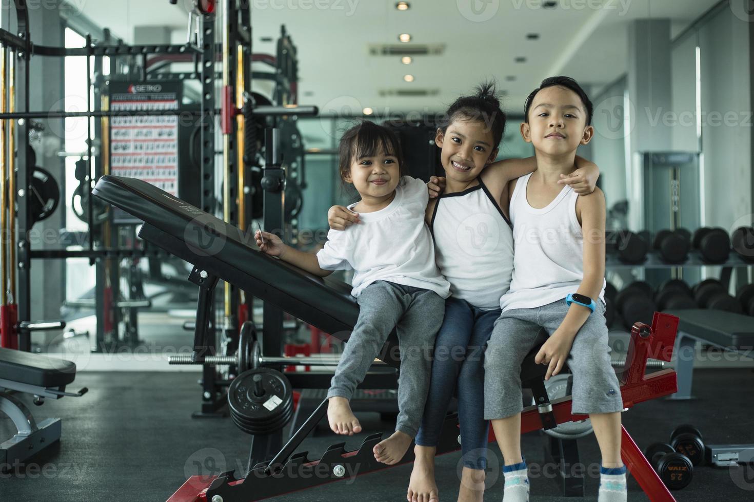 Group of children doing gymnastic exercises photo