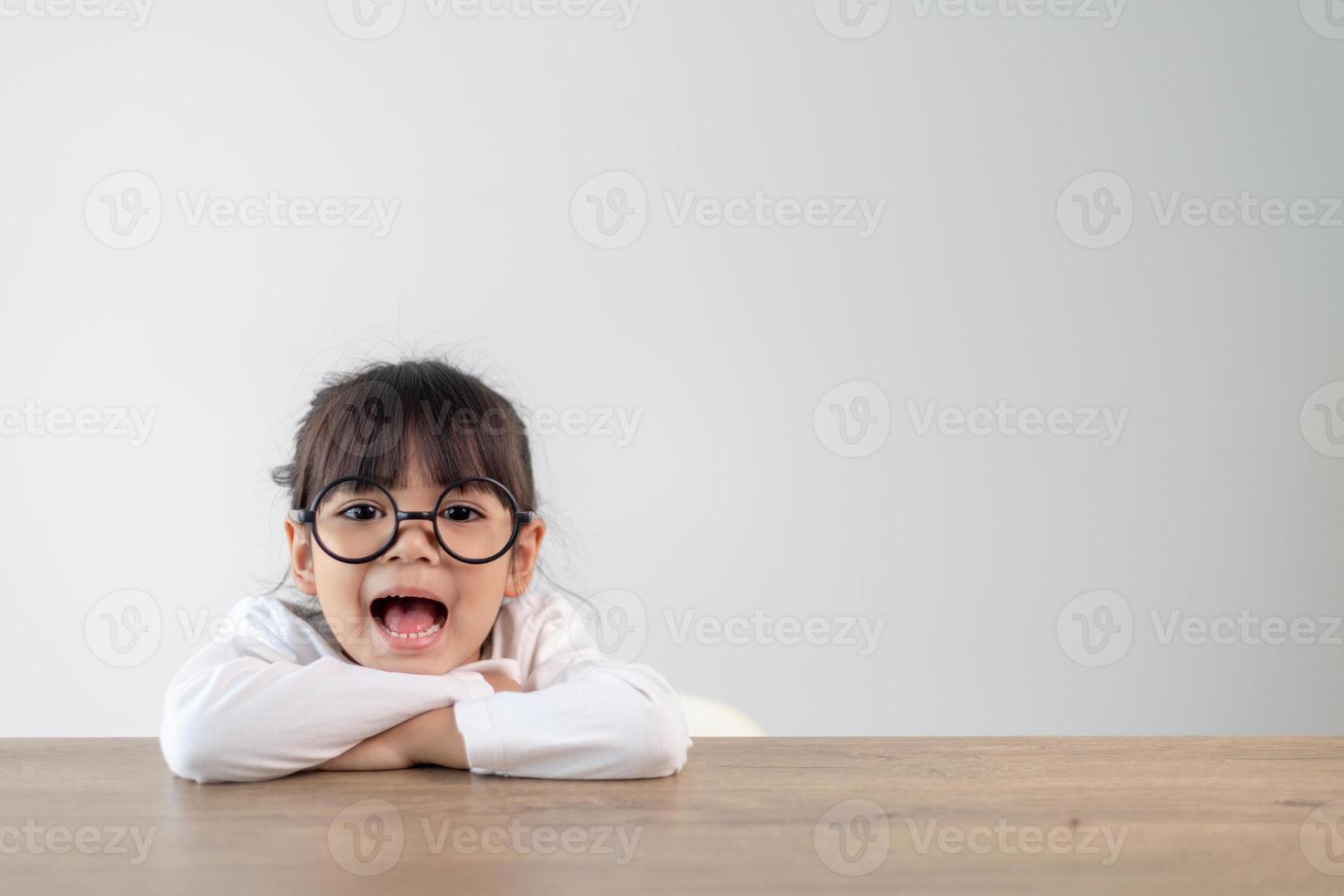 Cute little girl child in eyeglasses isolated. Education, school and vision concept photo