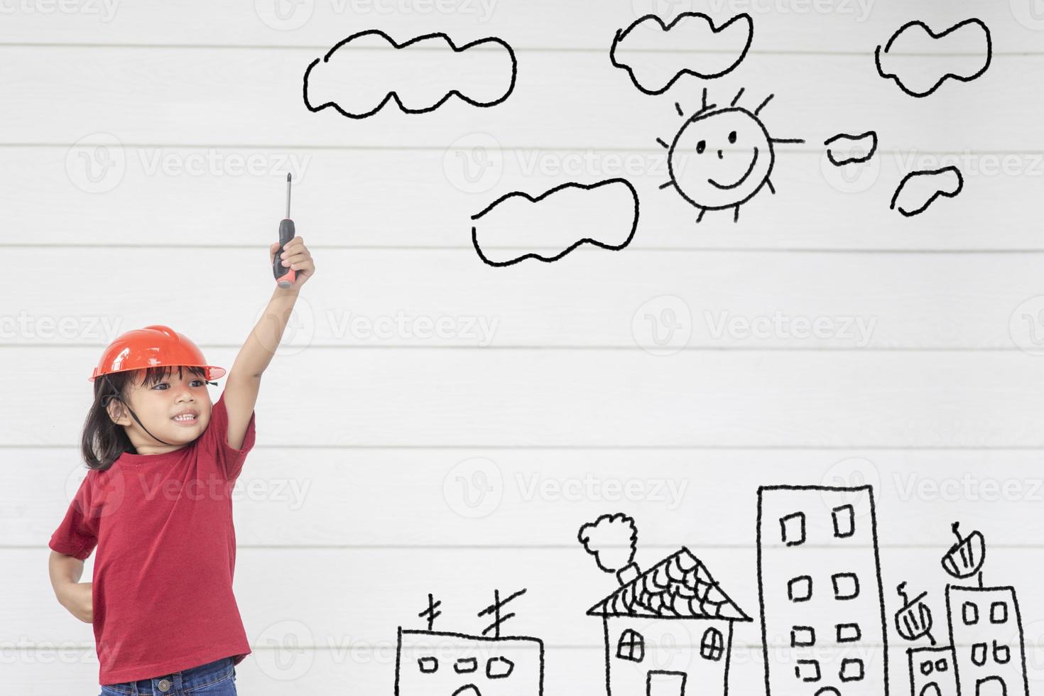 Asian Little girl engineering with creative drawing environment with happy family, photo