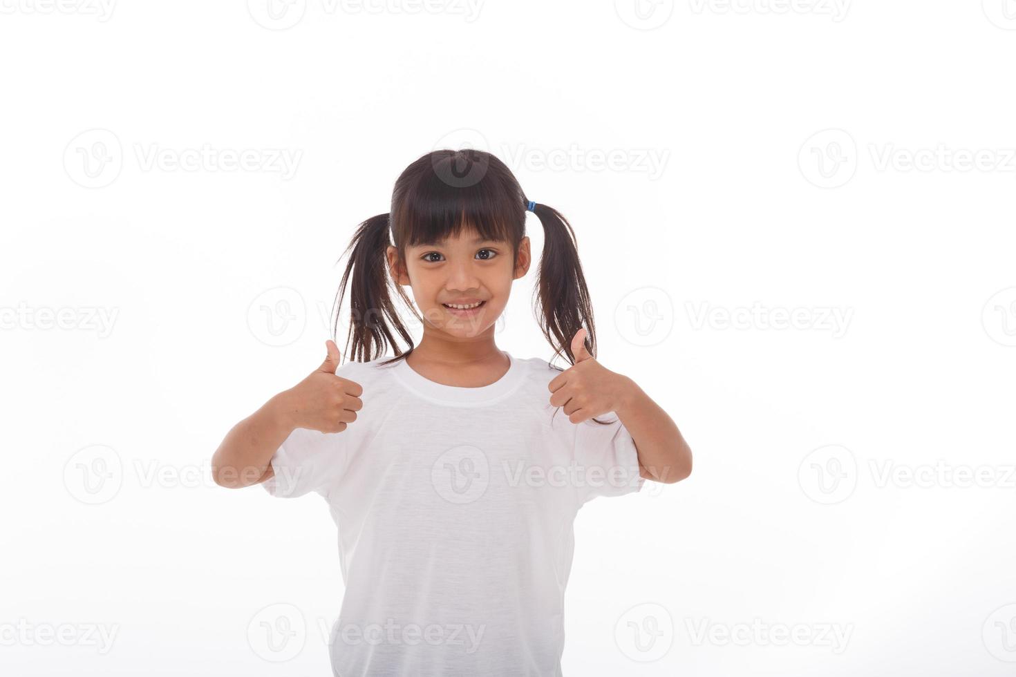 Little asian girl wearing mask for protect pm2.5 and show thumbs up gesture for good air outdoor.Air pollution pm2.5 and Coronavirus concept photo