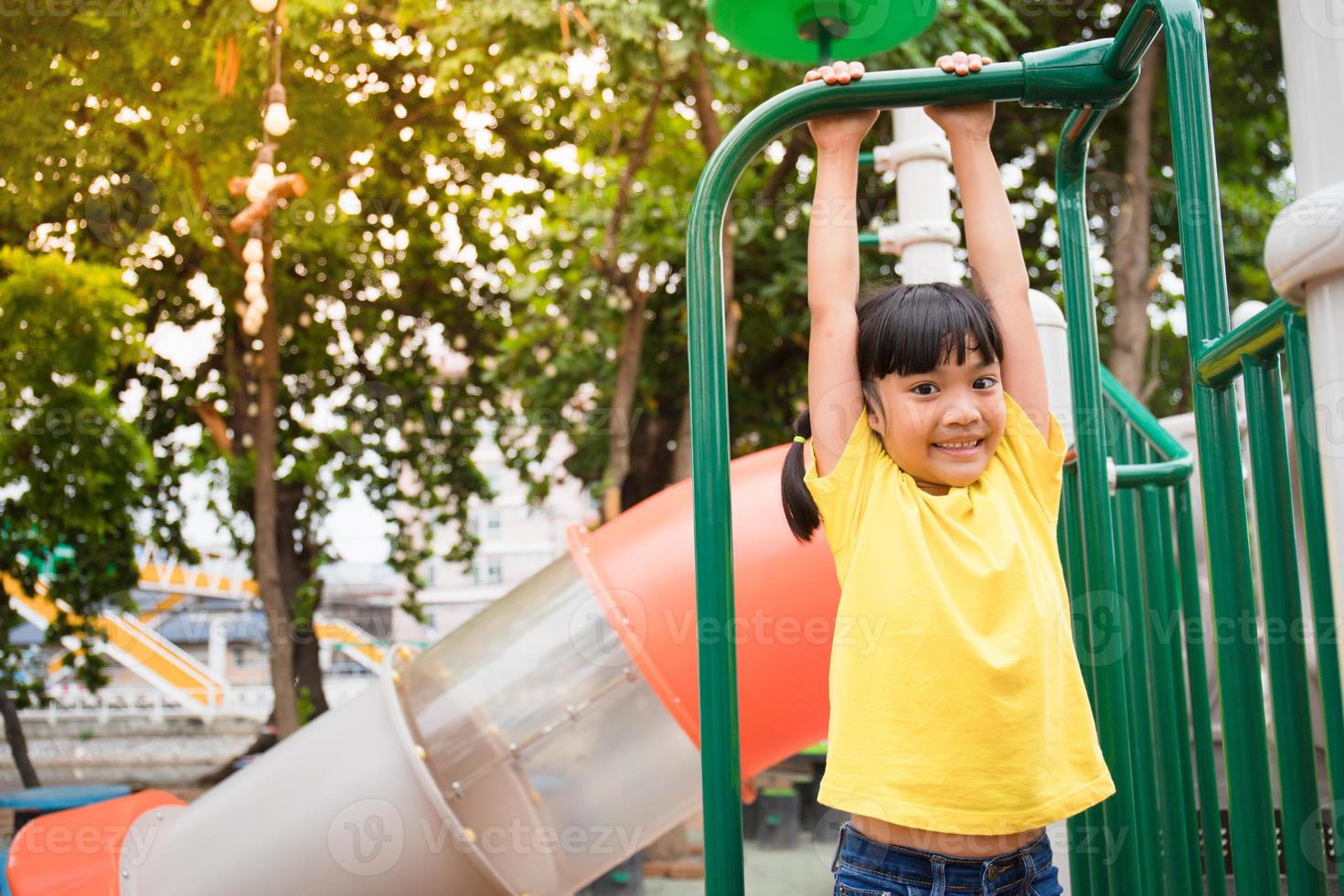 Active little girl on playground photo