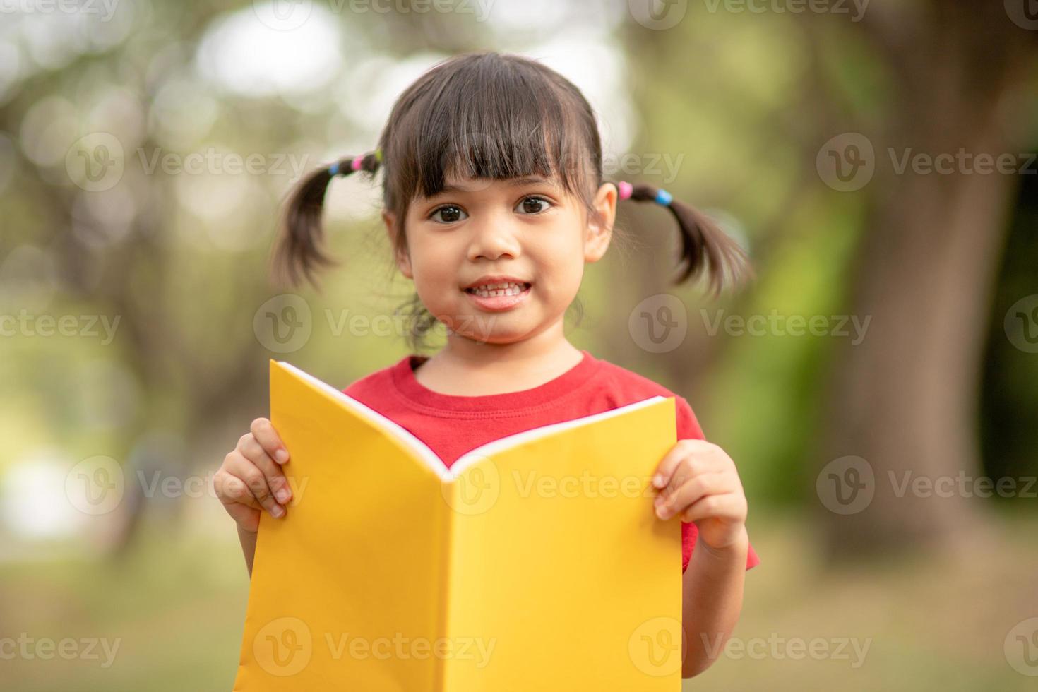 pretty girl The little girl is happy with the book photo