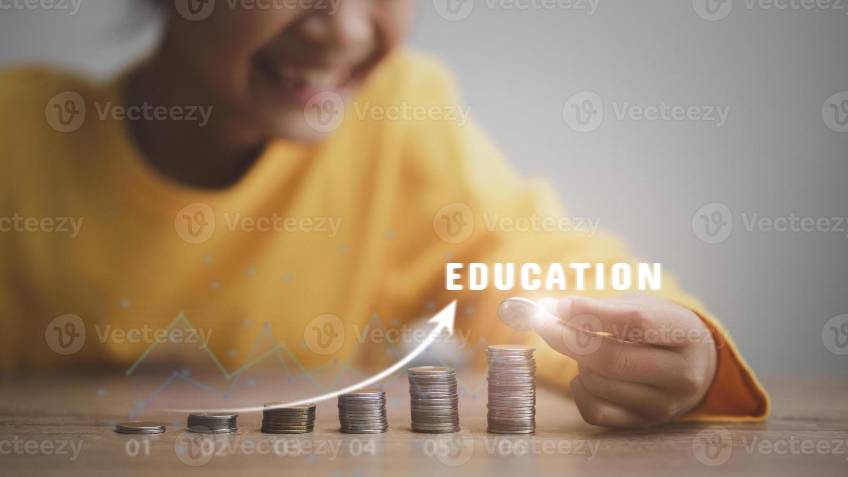 Cute Asian little child girl making stacks of coins . Kid saves money for future education. Money, finances, and people concept photo