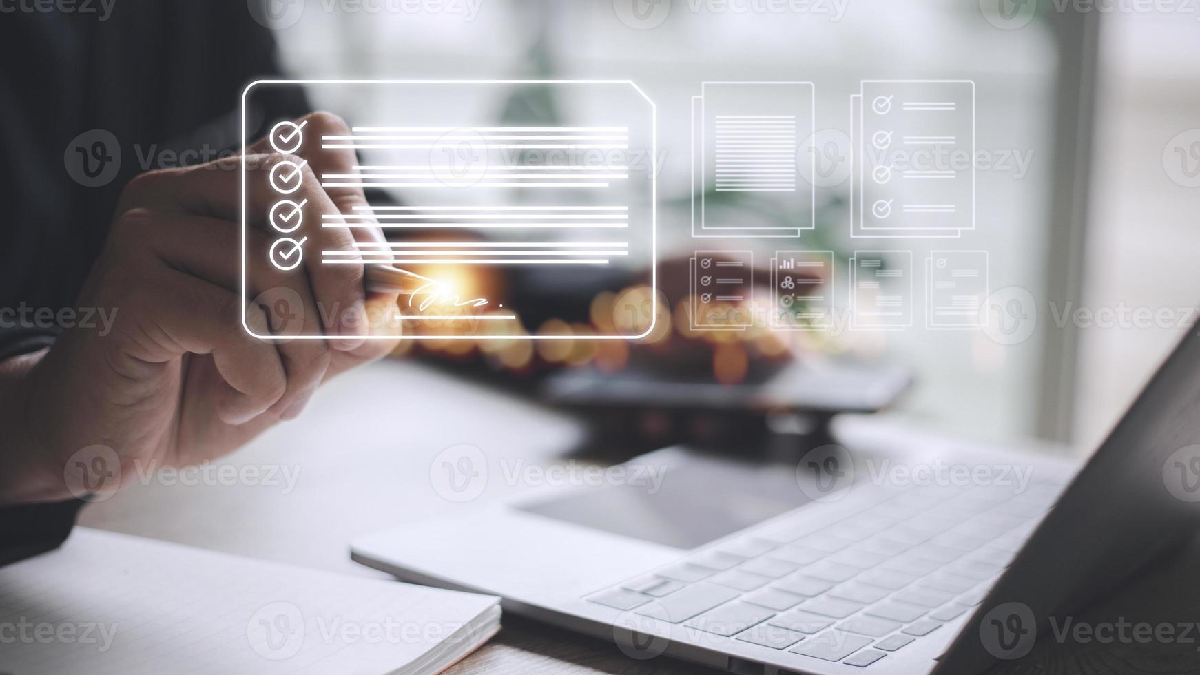 Electronic signature and paperless office concept. A person uses a pen to sign electronic documents on digital documents on a virtual screen. E-signing. Technology and document management photo