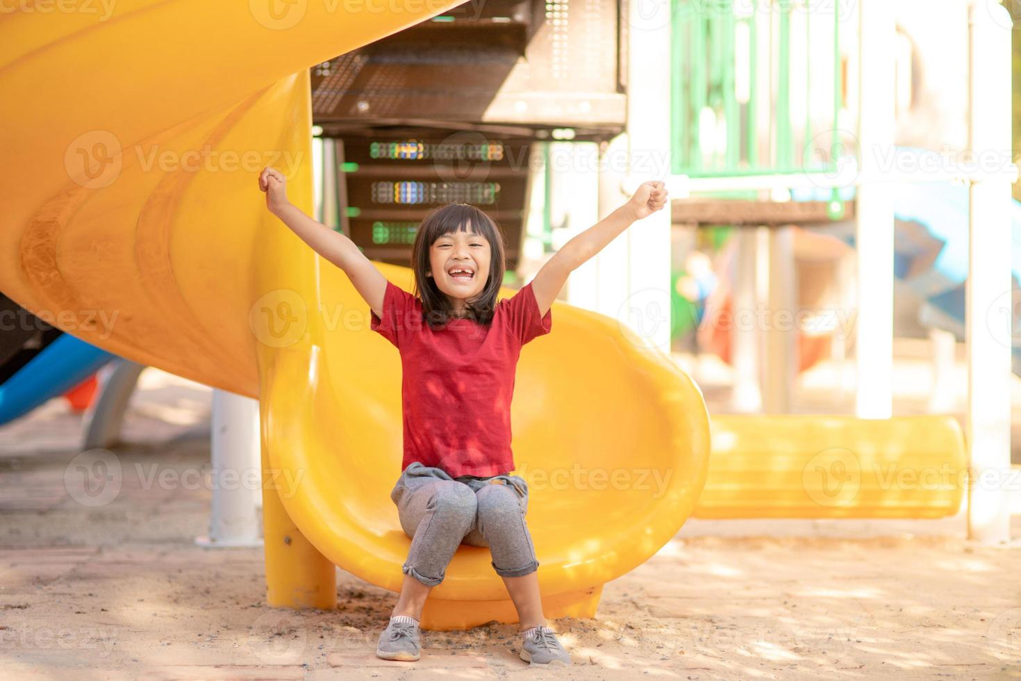 Active little girl on playground photo