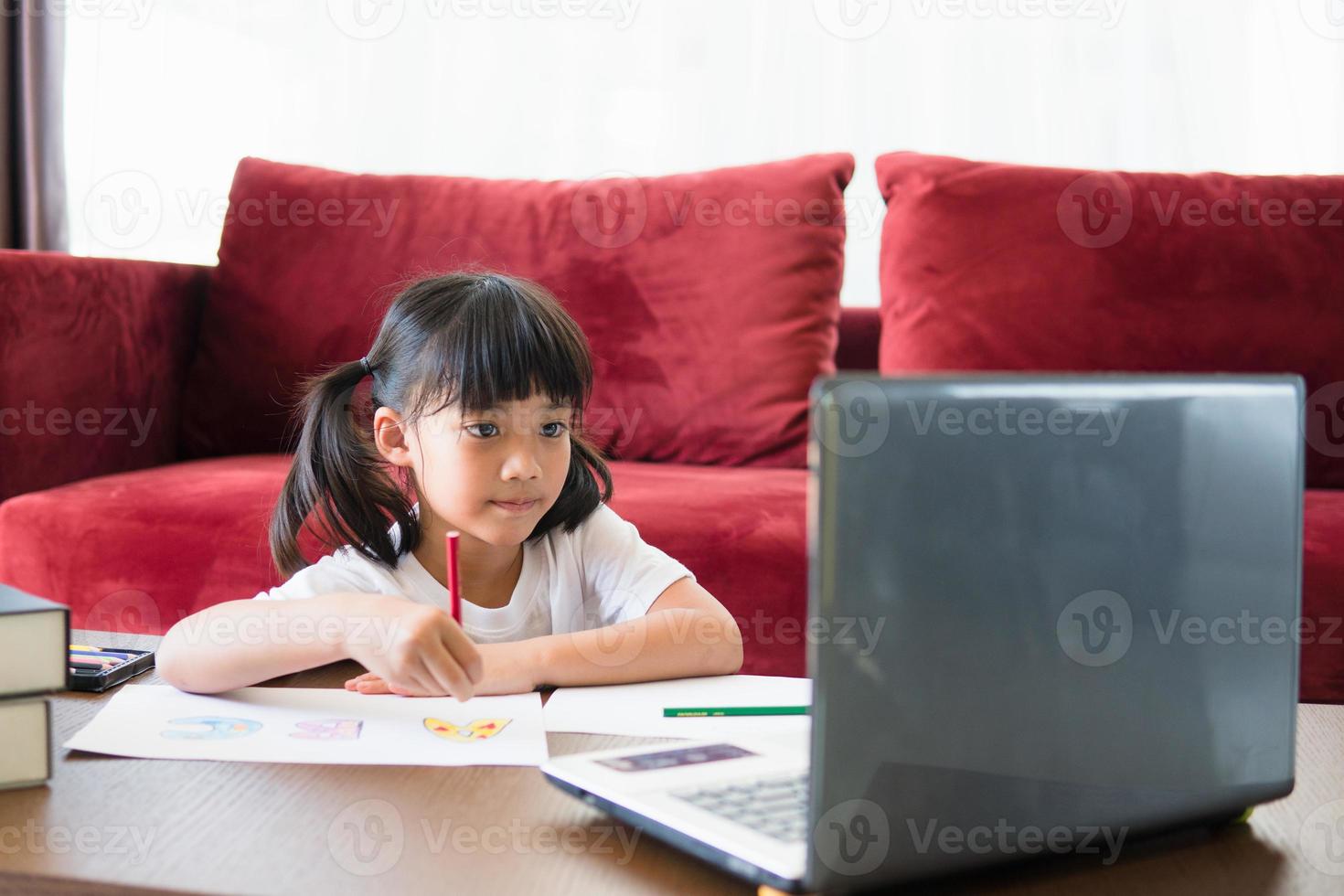 Asian girl student online learning class study online with laptop at home. photo