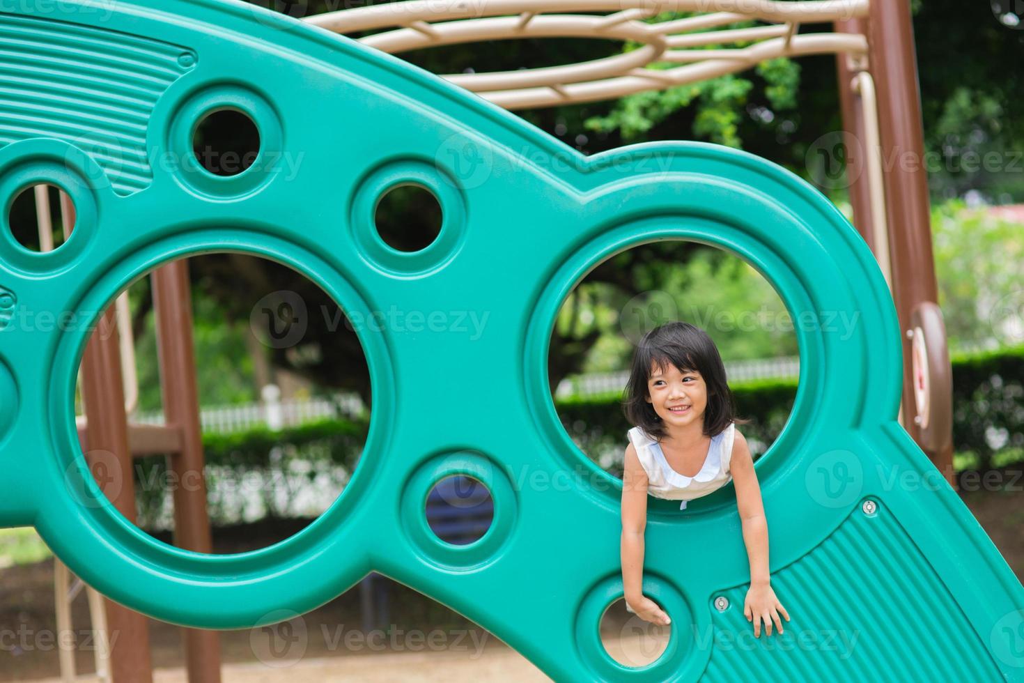 Active little girl on playground photo
