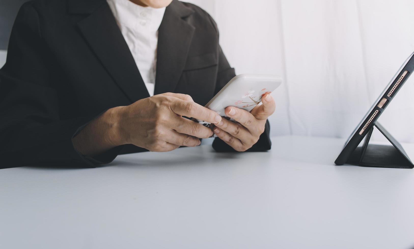 Woman hand using mobile smart phone, online payment, banking and online shopping at the home. photo