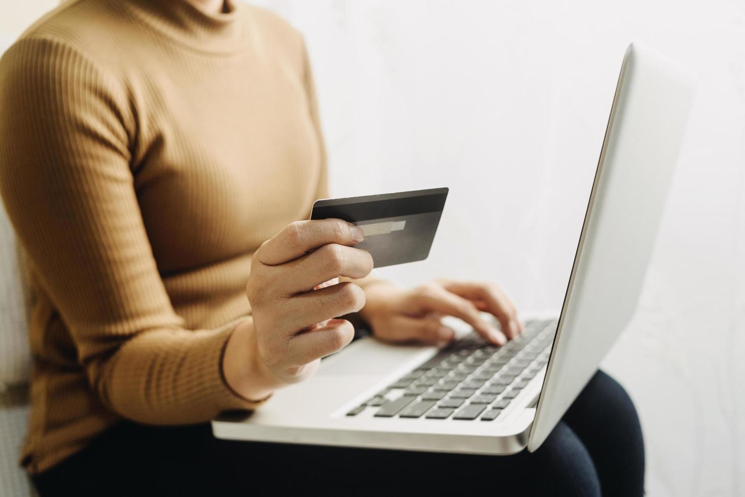 Woman hand using mobile smart phone, online payment, banking and online shopping at the home. photo