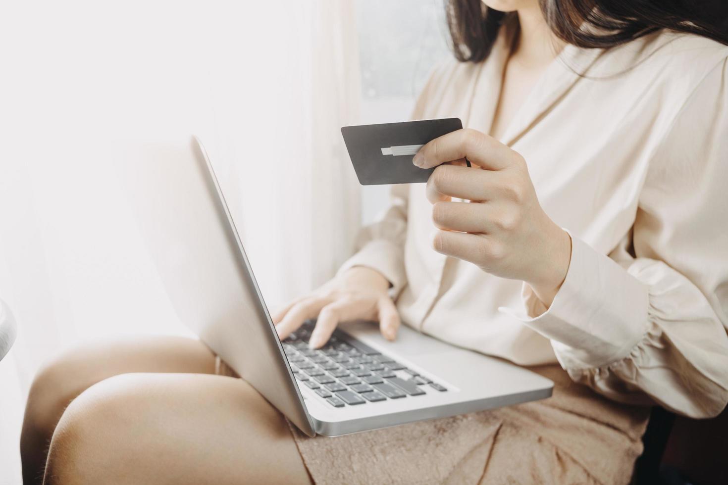 Woman hand using mobile smart phone, online payment, banking and online shopping at the home. photo