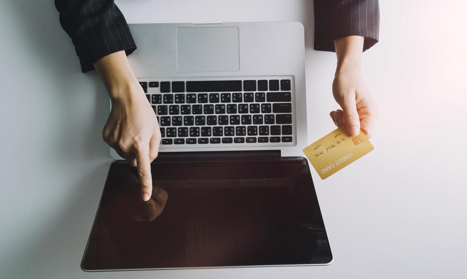 Woman hand using mobile smart phone, online payment, banking and online shopping at the home. photo