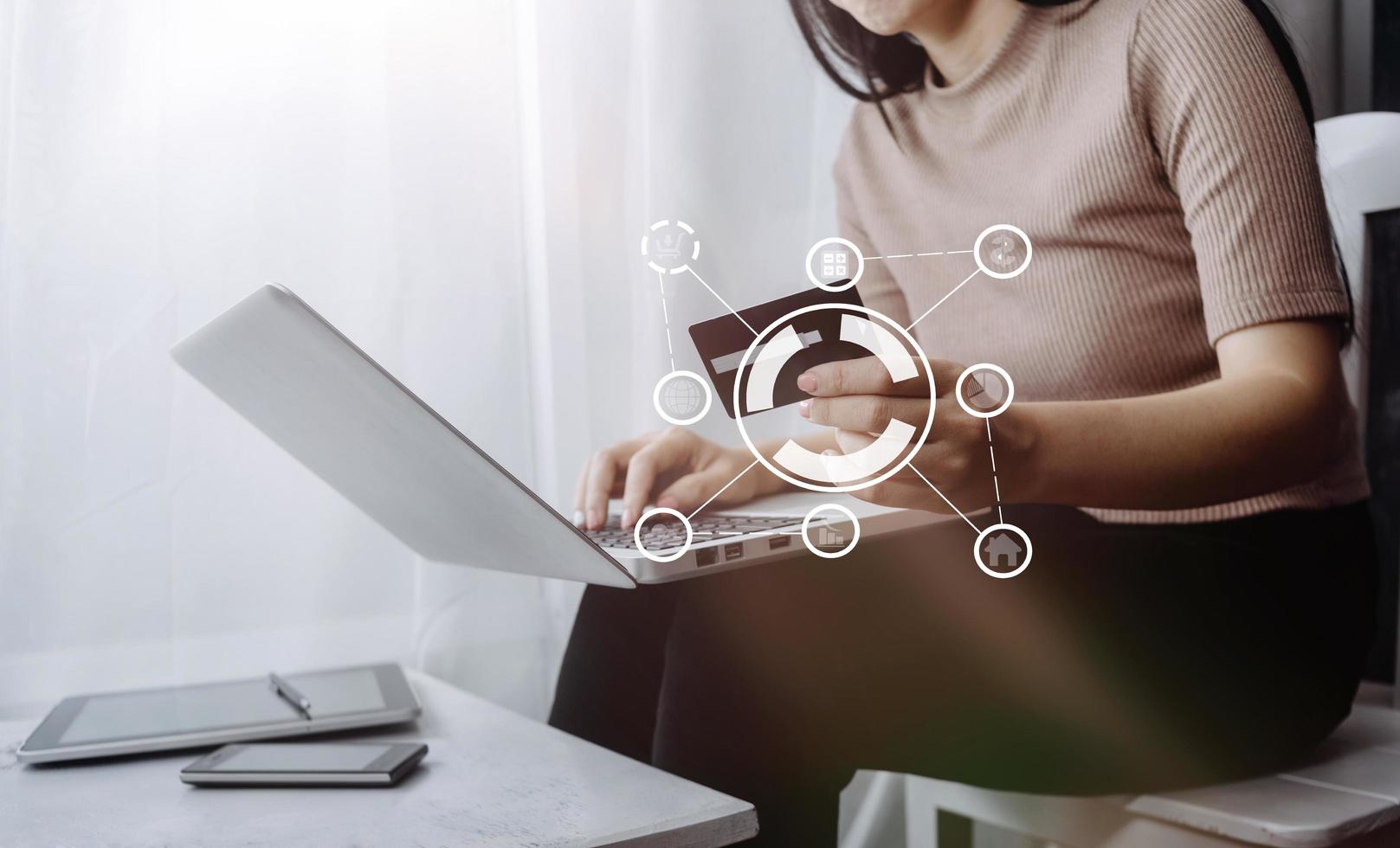 Woman hand using mobile smart phone, online payment, banking and online shopping at the home. photo