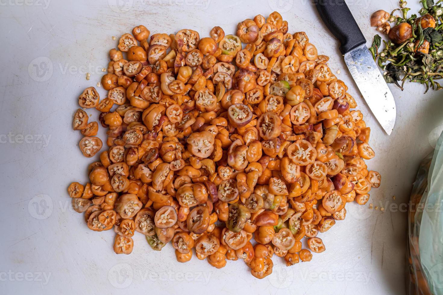 Many small fruit yellow peppers photo