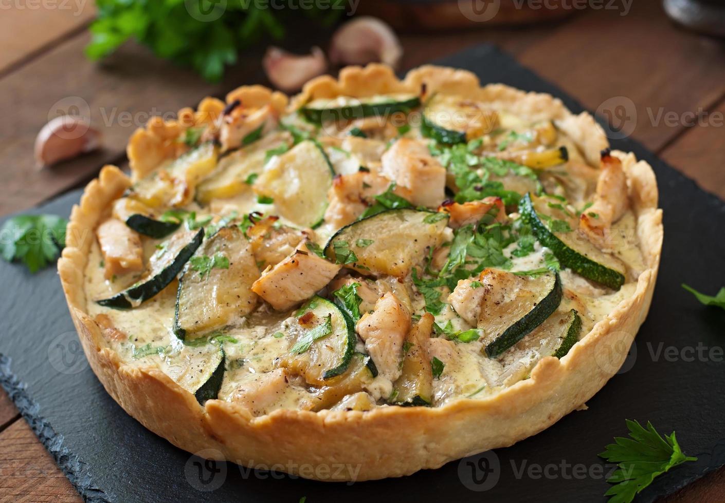 Quiche with chicken and zucchini with herbs photo