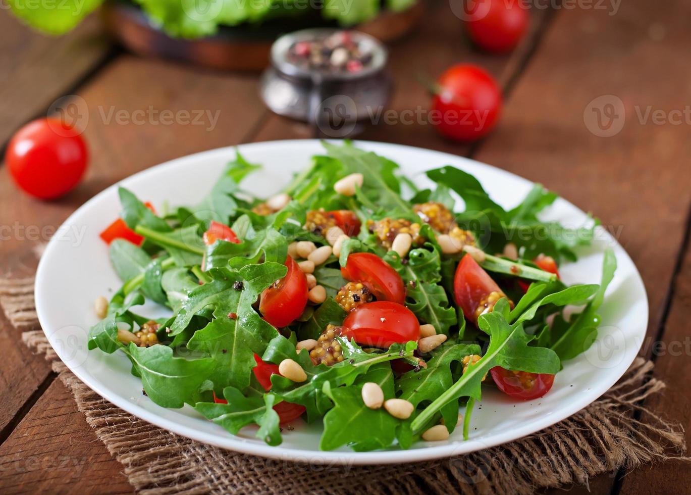 Fresh salad with chicken breast, arugula and tomato photo